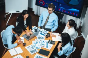 Business team analyzing charts and reports at a desk